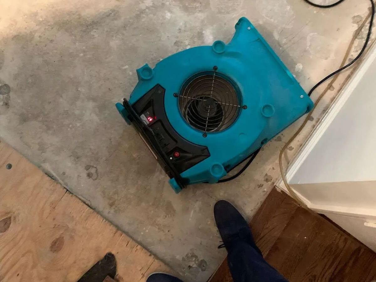 Air mover drying subfloor during Leak Detection & Repair in American Falls